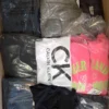 The photo shows a package with clothing in the category T.
