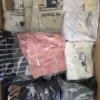 The photo shows a package with clothing in the category T.