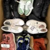 The photo shows a package with footwear in the category SH.