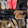 The photo shows a package with footwear in the category SH.