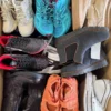 The photo shows a package with footwear in the category SH.