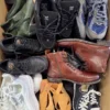 The photo shows a package with footwear in the category SH.