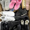 The photo shows a package with footwear in the category SH.
