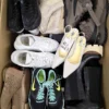 The photo shows a package with footwear in the category SH.