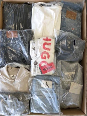 The photo shows a package with clothing in the category D.