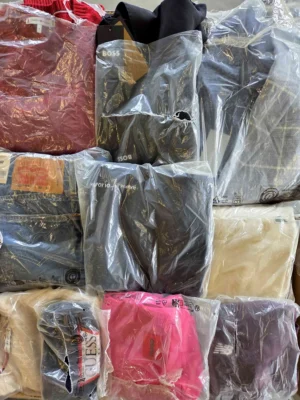 The photo shows a package with clothing in the category D.