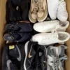 The photo shows a package with footwear in the category SH.