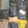 The photo shows a package with clothing in the category D.