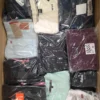 The photo shows a package with clothing in the category T.