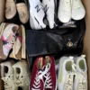 The photo shows a package with footwear in the category SH.