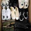 The photo shows a package with footwear in the category SH.