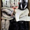 The photo shows a package with footwear in the category SH.