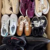 The photo shows a package with footwear in the category SH.