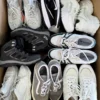 The photo shows a package with footwear in the category SH.
