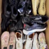 The photo shows a package with footwear in the category SH.
