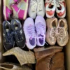 The photo shows a package with footwear in the category SH.