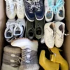 The photo shows a package with footwear in the category SH.