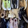 The photo shows a package with footwear in the category SH.