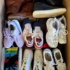 The photo shows a package with footwear in the category SH.