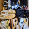 The photo shows a package with footwear in the category SH.
