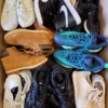 The photo shows a package with footwear in the category SH.