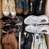 The photo shows a package with footwear in the category SH.