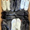 The photo shows a package with footwear in the category CSU.
