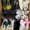 The photo shows a package with footwear in the category SH.