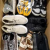 The photo shows a package with footwear in the category SH.