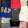 The photo shows a package with clothing in the category U.