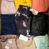 The photo shows a package with clothing in the category U.