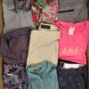 The photo shows a package with clothing in the category U.