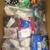 The photo shows a package with clothing in the category ABW.