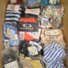 The photo shows a package with clothing in the category ABW.