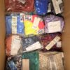 The photo shows a package with clothing in the category ABW.