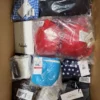 The photo shows a package with clothing in the category ABW.