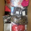 The photo shows a package with clothing in the category ABW.