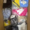 The photo shows a package with clothing in the category ABW.