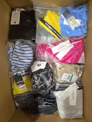The photo shows a package with clothing in the category ABW.