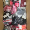 The photo shows a package with clothing in the category ABW.
