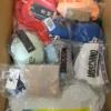 The photo shows a package with clothing in the category AU.