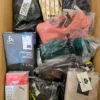 The photo shows a package with clothing in the category AU.