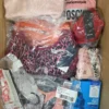 The photo shows a package with clothing in the category AU.