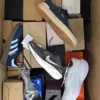The photo shows a package with footwear in the category BS.