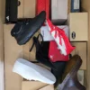 The photo shows a package with footwear in the category BS.