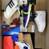 The photo shows a package with footwear in the category BS.