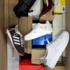 The photo shows a package with footwear in the category BS.