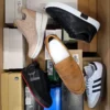 The photo shows a package with footwear in the category BS.