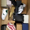 The photo shows a package with footwear in the category BS.