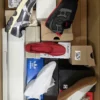 The photo shows a package with footwear in the category BS.